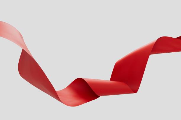 istock Swirling red fabric ribbon on white background 3d render. 1432635733