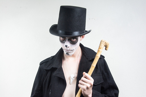 man with skull and skeleton in day of the dead
