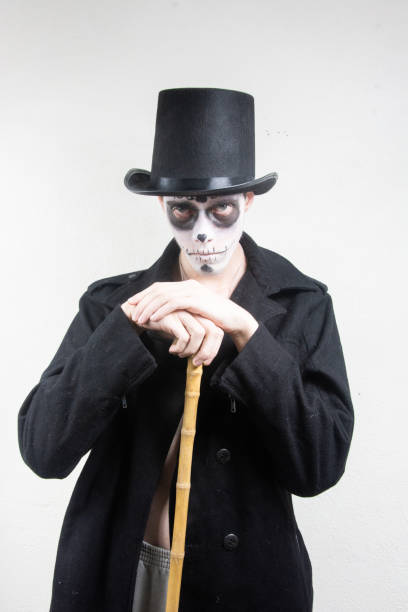 istock man with skull and skeleton in halloween costume 1432635789