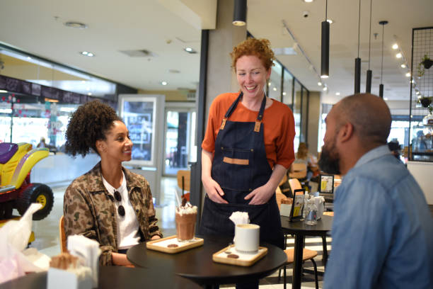 istock man and woman being served by a waitress in a cafeteria 1432637210