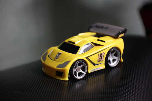 photo of a yellow car toy for boys