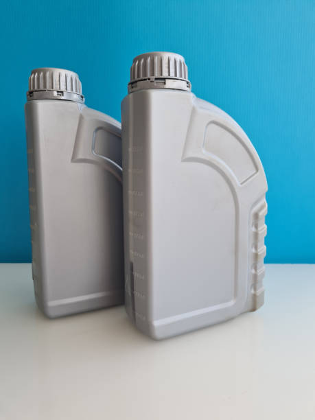 istock Bottle with motor oil on blue background 1432637496