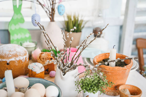istock Table decoration for Easter celebration in kitchen.Tablescape for Easter holiday at home.Family religious traditional festive christianity,catholic meal food.Pop color eggs,cake,fun bunny,candy sweet 1432637739
