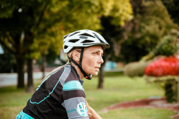 istock Pretty mature female cyclist on the ride 1432643832