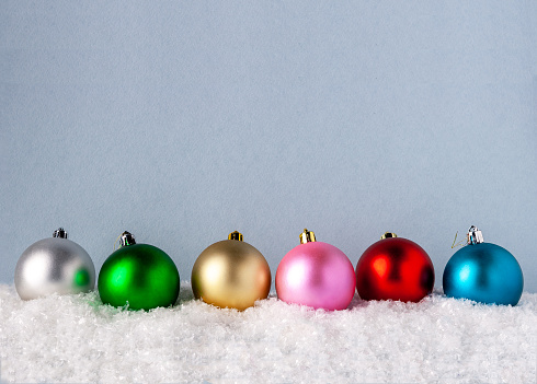 square with differently colored christmas baubles. 