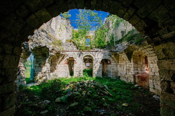 istock Old ancient abandoned church ruins overgrown by plants 1432649545