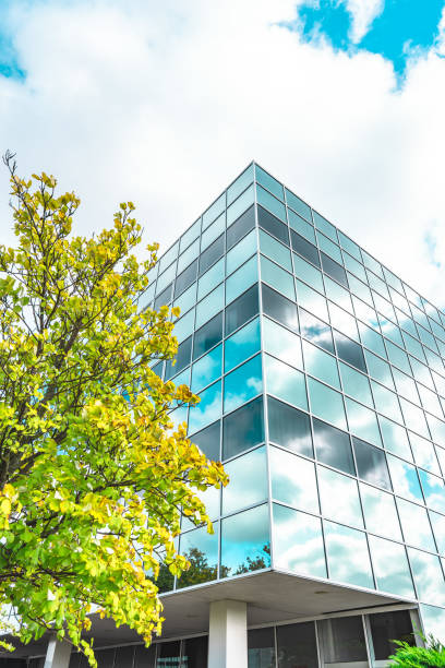 istock Business towers and Green leaves 1432652355