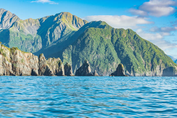 Mountains and sea stacks along the rugged coastline of Resurrection Bay near Seward, Alaska