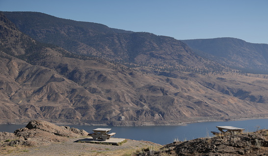 View of Kamloops Lake in the Thompson River in the semi-arid Thompson-Nicola Regional District. Autumn morning with some atmospheric haze from a wildfire in the Southern Interior of British Columbia.