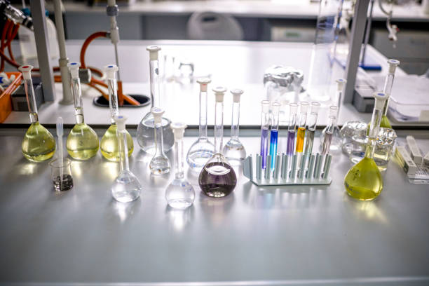 A few chemical bottles and test tubes seen in a laboratory with all other equipment during some pharmaceutical research.