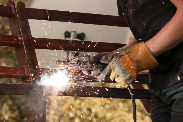 istock Welder welds metal by arc welding, welding of metal structures 1432667766