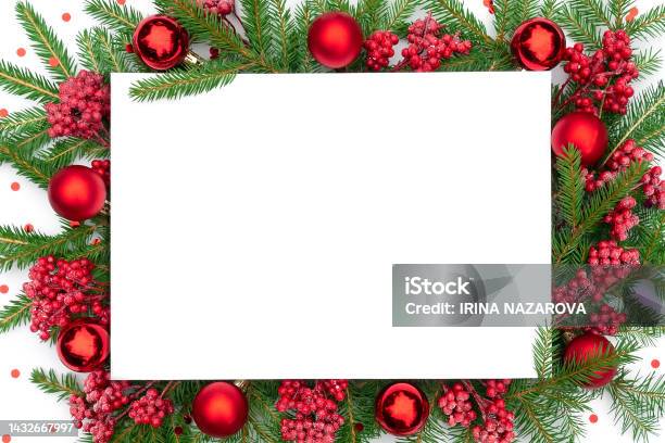 Traditional Christmas Background With Christmas Decorations In Red Colors Christmas Frame Made Of Real Spruce Branches With Festive Decorations And Confetti Merry Christmas Design Template Stock Photo - Download Image Now