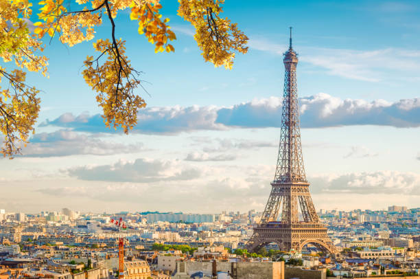 eiffel tour and Paris cityscape famous Eiffel Tower landmark and Paris old roofs at fall day, Paris France, toned paris france stock pictures, royalty-free photos & images
