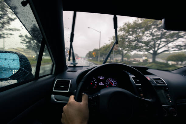 istock Inclement Weather Suburbs - Driving Through Intersection - Driving in the Rain - Wide Angle 1432671438
