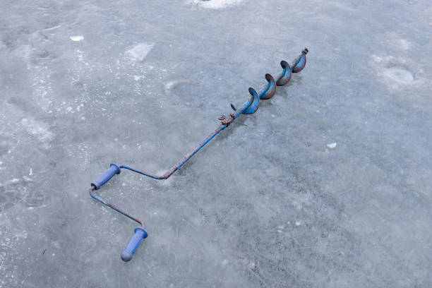 istock equipment for winter fishing on ice. ice drill 1432671601