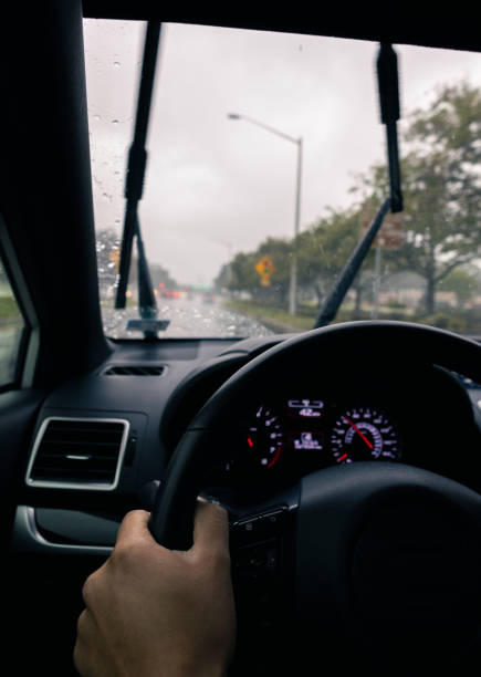 istock Inclement Weather Suburbs - Driving Through Intersection - Driving in the Rain 1432671612