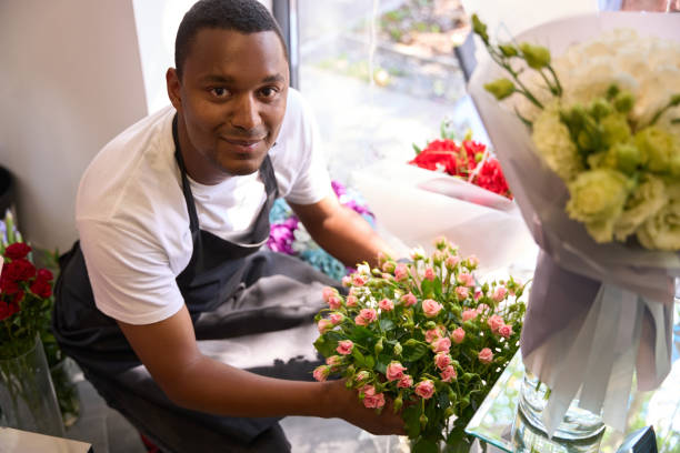 istock Man squatting with a bouquet of hands 1432674828