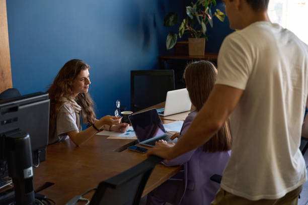 istock Young team of progressive specialists are busy discussing work tasks 1432674917