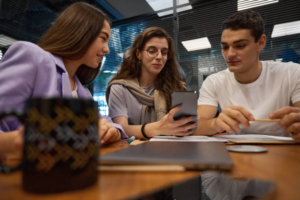 istock Colleagues looking at photos on the phone during a break 1432674927