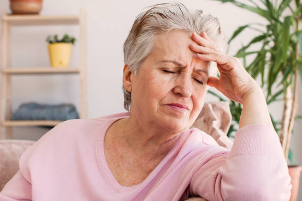 istock middle aged lady looking away sit alone at home feel anxious lonely, sad 1432676757