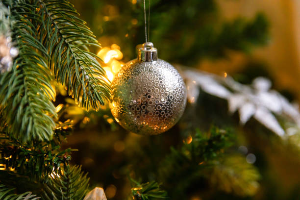 istock Classic Christmas decorated New year tree. Christmas tree with wite and silver decorations, ornaments toy and ball. Modern classical style interior design apartment. Christmas eve at home. 1432679559