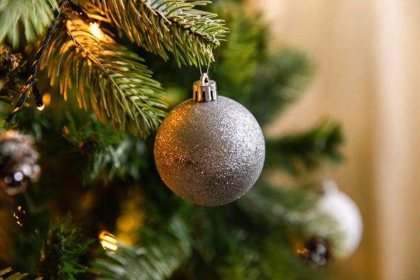 istock Classic Christmas decorated New year tree. Christmas tree with wite and silver decorations, ornaments toy and ball. Modern classical style interior design apartment. Christmas eve at home. 1432679566
