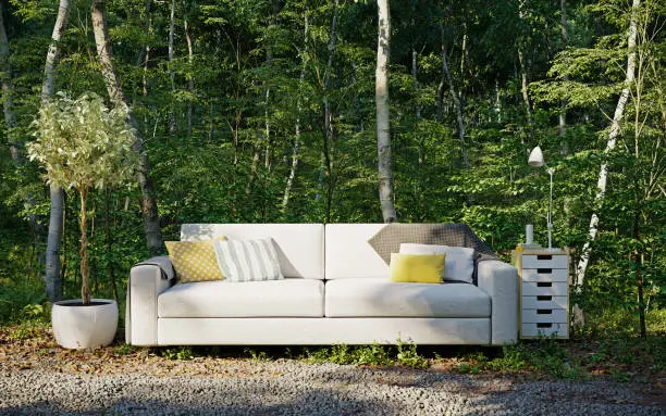A Surreal Fantasy with a sofa outside in the forest . Idyllic scenery as if it came out of a fairy tale. 3d illustration