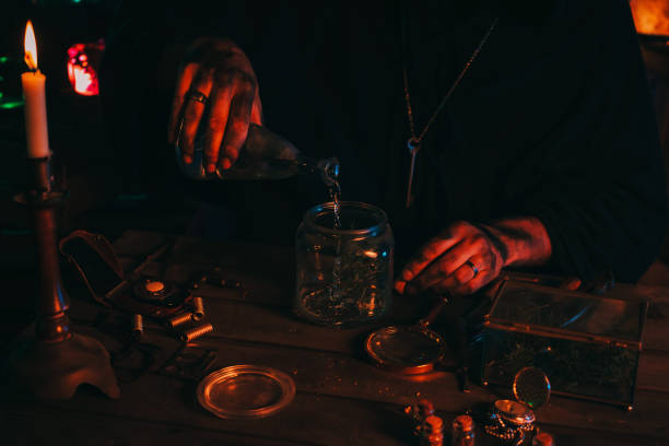 istock alchemist magician sorcerer does experiments with a potion in a laboratory 1432686458