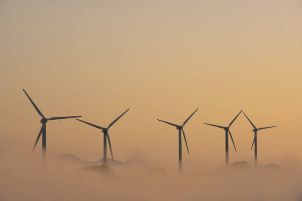 istock Wind turbines above the clouds at sunset 1432686557