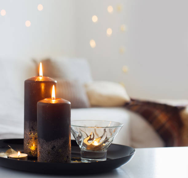 istock black and golden candles on white table 1432689088