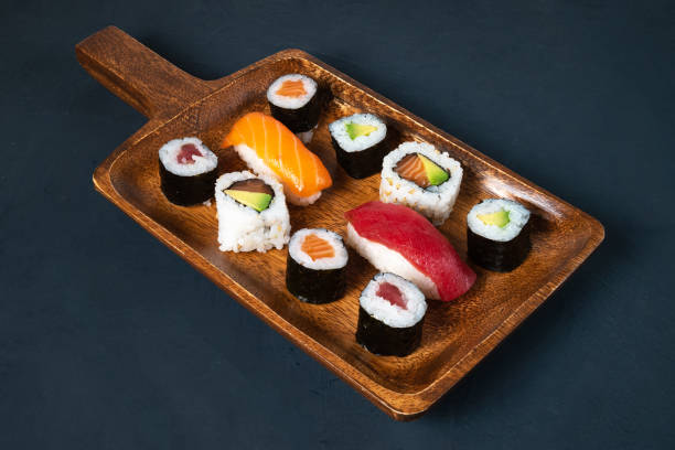 istock maki sushi board on dark background 1432689629