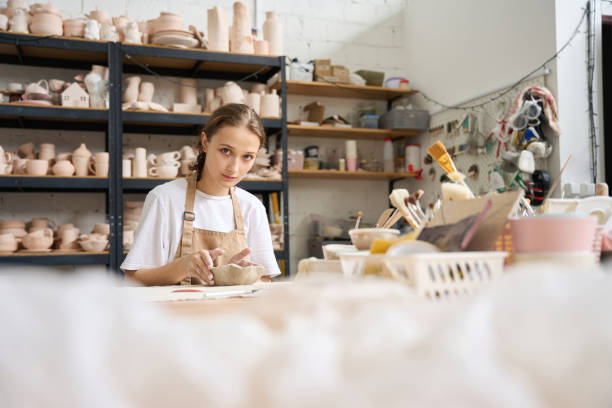 istock Craftswoman working at the table and looking at the camera 1432692586