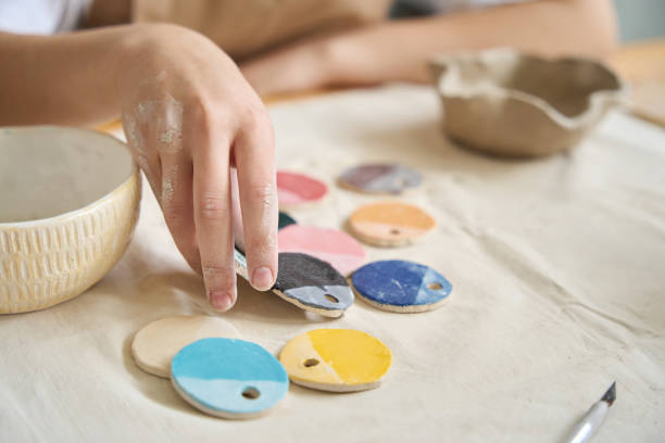 istock Woman choosing paint sample for clay products 1432692593