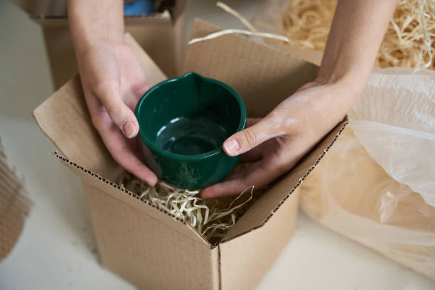 istock Woman holding a green ceramic cup in her hands 1432692697