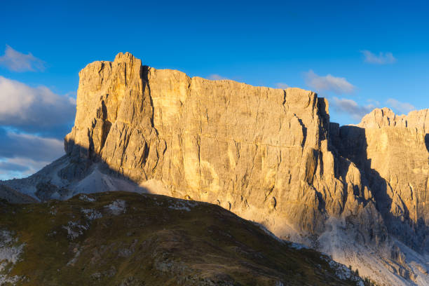 istock Dolomite Alps, Italy. View of the mountains and high cliffs during sunset. High sharp rocks and soft sunshine. Natural landscape. Photo in high resolution. 1432696869
