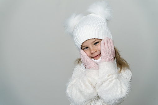 Caucasian girl in warm clothing.