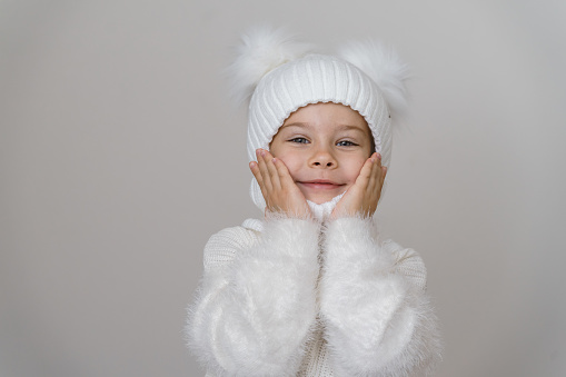 Caucasian girl in warm clothing.