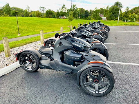 Fairfax, Virginia, USA - September 26, 2022: A row of Can-Am Ryker Sport 3-Wheel Vehicles is lined up together in a parking lot at George Mason University’s West Campus.