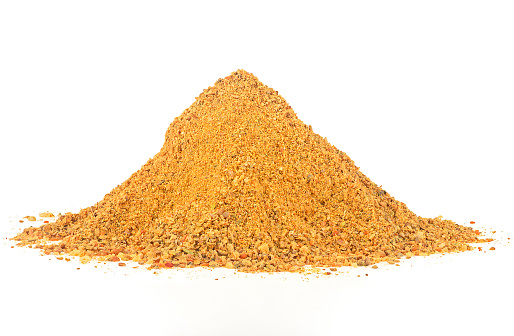 Heap of curry powder isolated on a white background