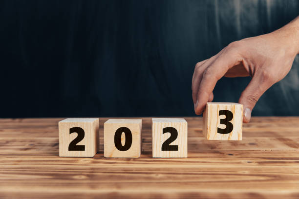 istock Man puts wooden cube for 2023 1432703491