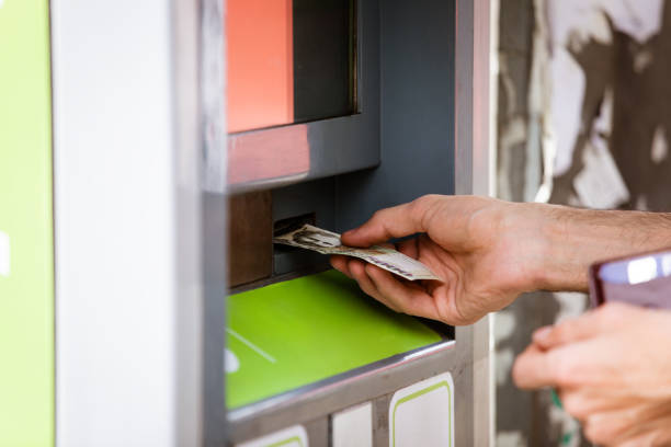 istock A man enters money into the terminal 1432703516