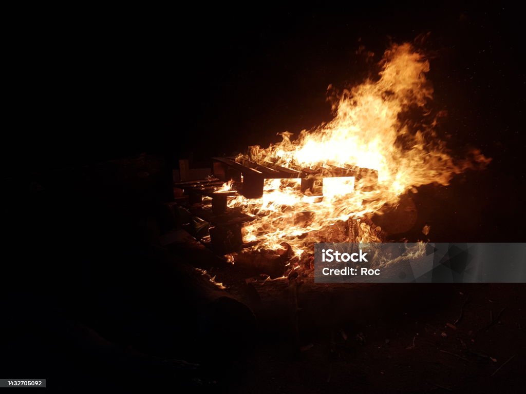 Bonfire Stack of pallets being burnt Black Color Stock Photo