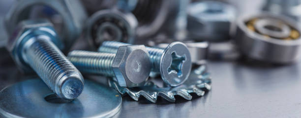 istock set of different nuts, bolts, screws, washers and drill bits,thread tap and mill cutters on steel plate background. Locksmithing deal. 1432705554