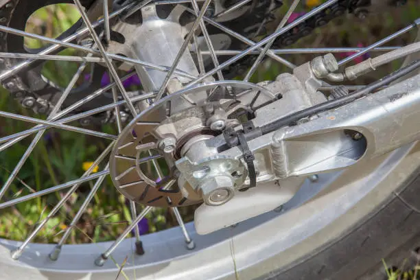 Disk brake system mounted at trial motorcycle. Trial motobike trial parts closeup