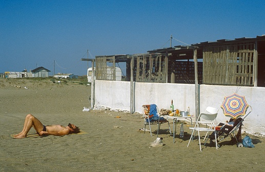 Andalucia, Spain, 1978. Young family relaxing on an unknown stretch of beach on the Andalucia coast.
