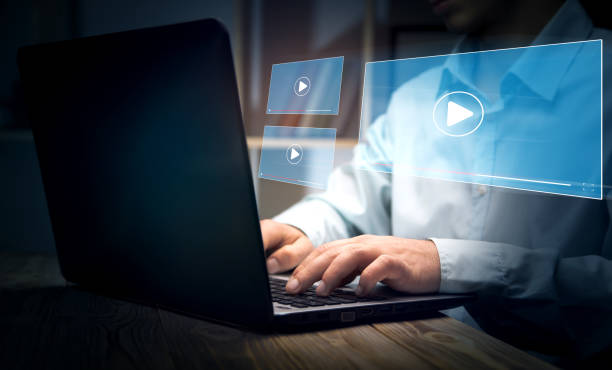 istock Hands of man using laptop to stream Watch videos 1432706838