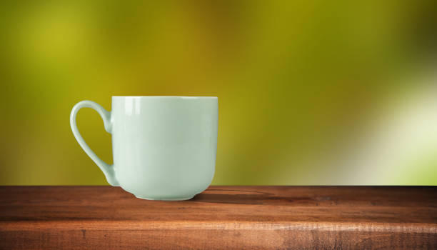 istock Cup with coffee on the table on nature background 1432706871