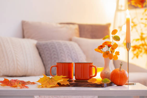 istock two orange cups with hot drink in autumnal light interior 1432707467