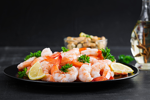 Seafood, shrimp on kebab and dish in studio on white background from above for luxury cuisine. Restaurant, catering and dinner serving with prawn skewer on plate for health, diet or nutrition