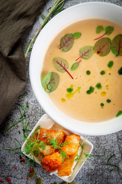 istock Pumpkin carrot puree soup on a gray stone table 1432710493